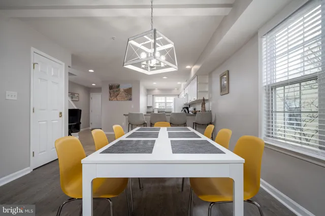 a view of a dining room with furniture and window