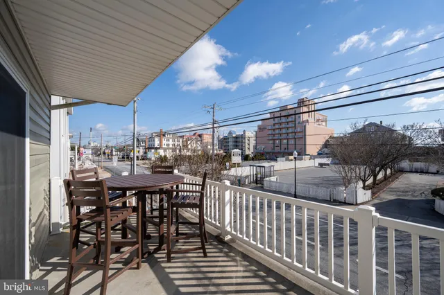 a view of a chairs and table in patio