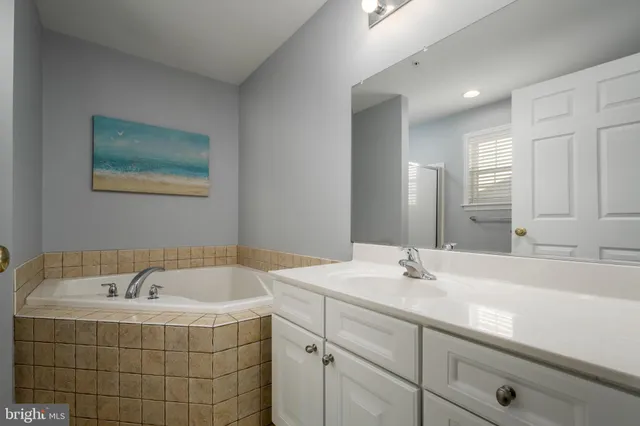 a bathroom with a bathtub and a sink