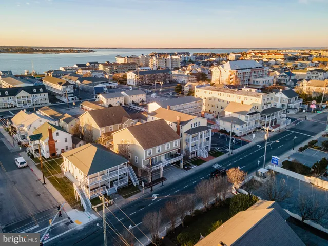 an aerial view of a city with ocean view