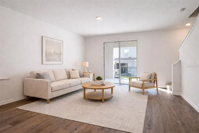 a living room with furniture and a large window