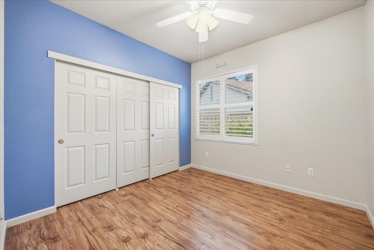 286 Lariat Loop Lincoln, CA 95648 - Photo 16 of 37 a view of an empty room with wooden floor and a window