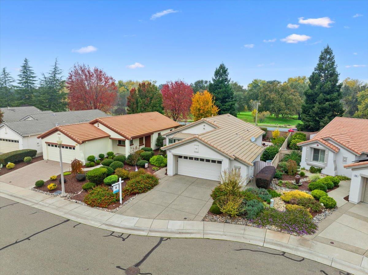 286 Lariat Loop Lincoln, CA 95648 - Photo 24 of 37 an aerial view of a house with a yard and potted plants