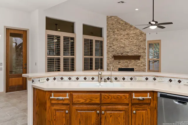 a view of a entryway with chandelier fan