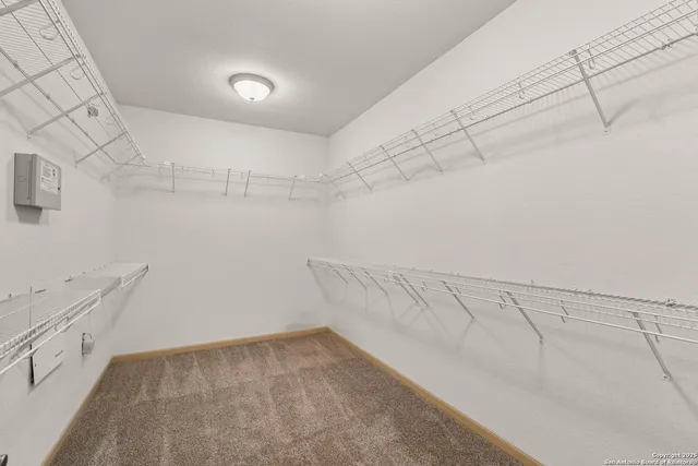 a view of a room with racks on the wall