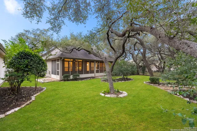 a view of a house with a backyard