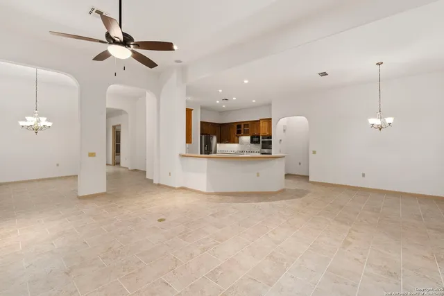 a view of a kitchen with a sink cabinets and appliances
