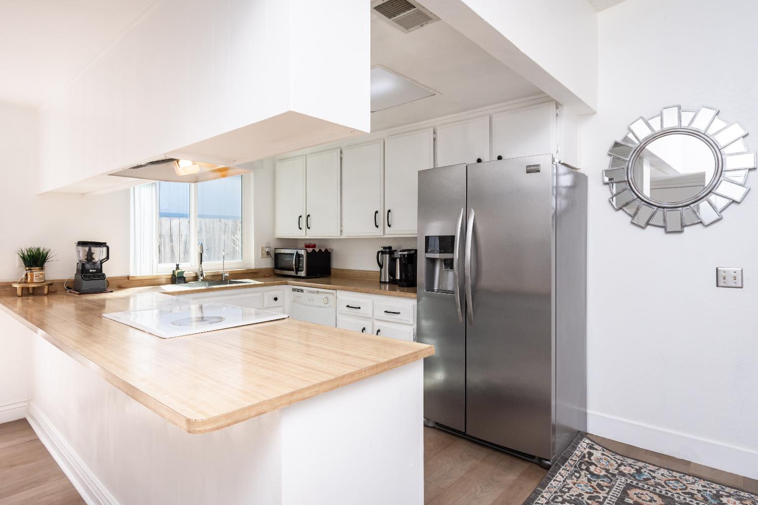 2000 Inglis Way, Unit A Roseville, CA 95678 - Photo 12 of 45 a kitchen with stainless steel appliances granite countertop a refrigerator a sink and a stove