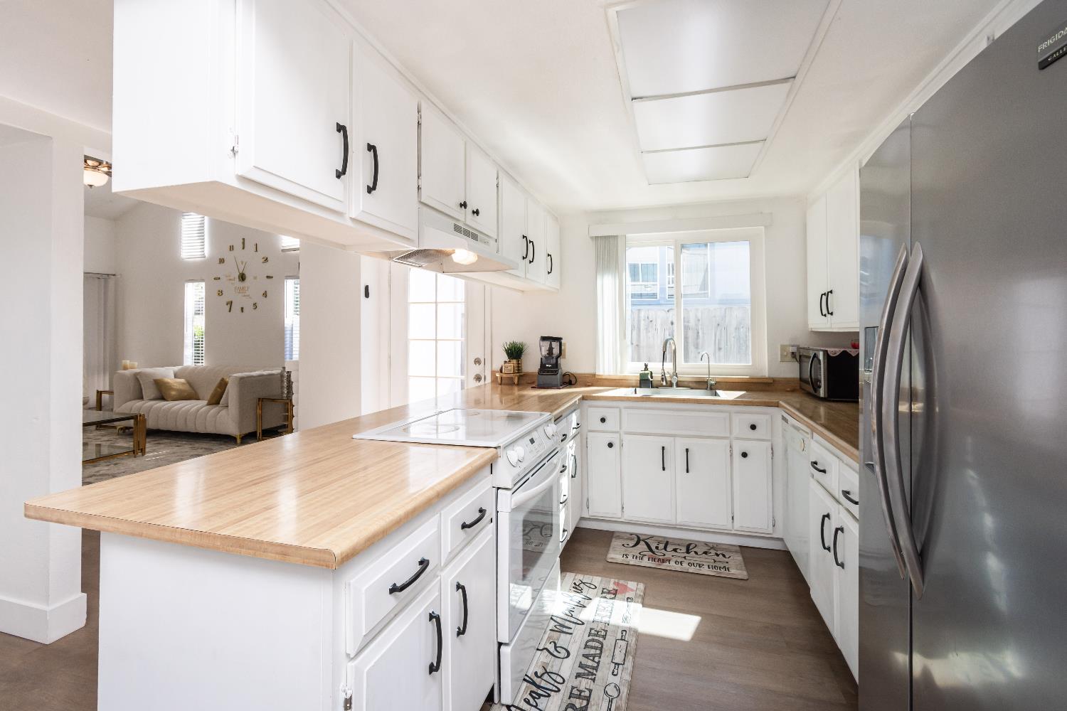 2000 Inglis Way, Unit A Roseville, CA 95678 - Photo 13 of 45 a large kitchen with a sink and cabinets