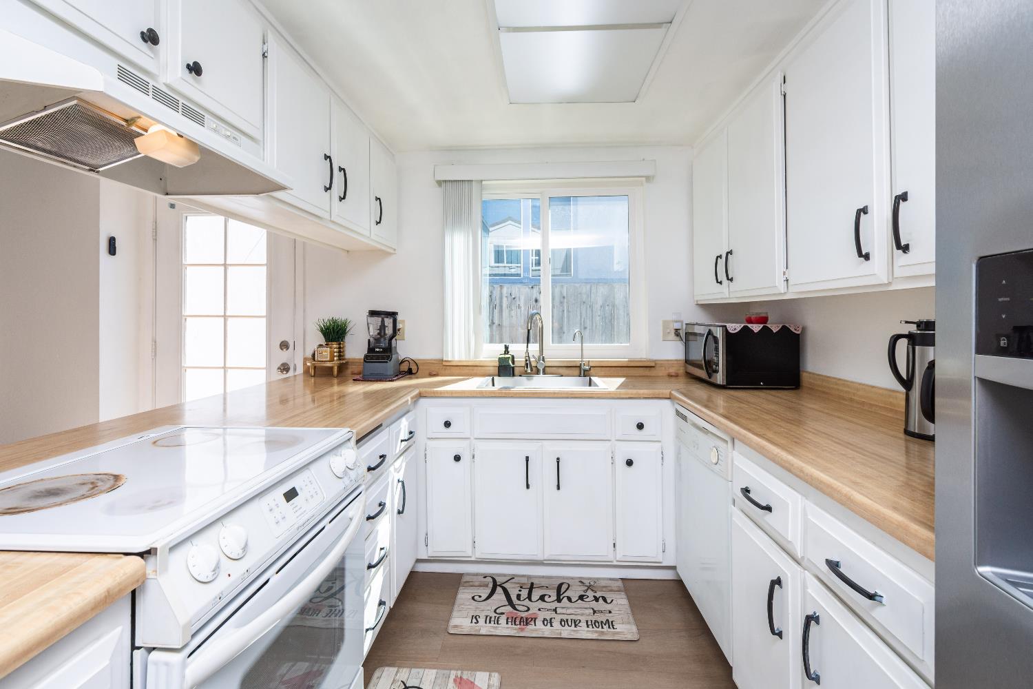 2000 Inglis Way, Unit A Roseville, CA 95678 - Photo 14 of 45 a kitchen with granite countertop a sink stainless steel appliances and cabinets