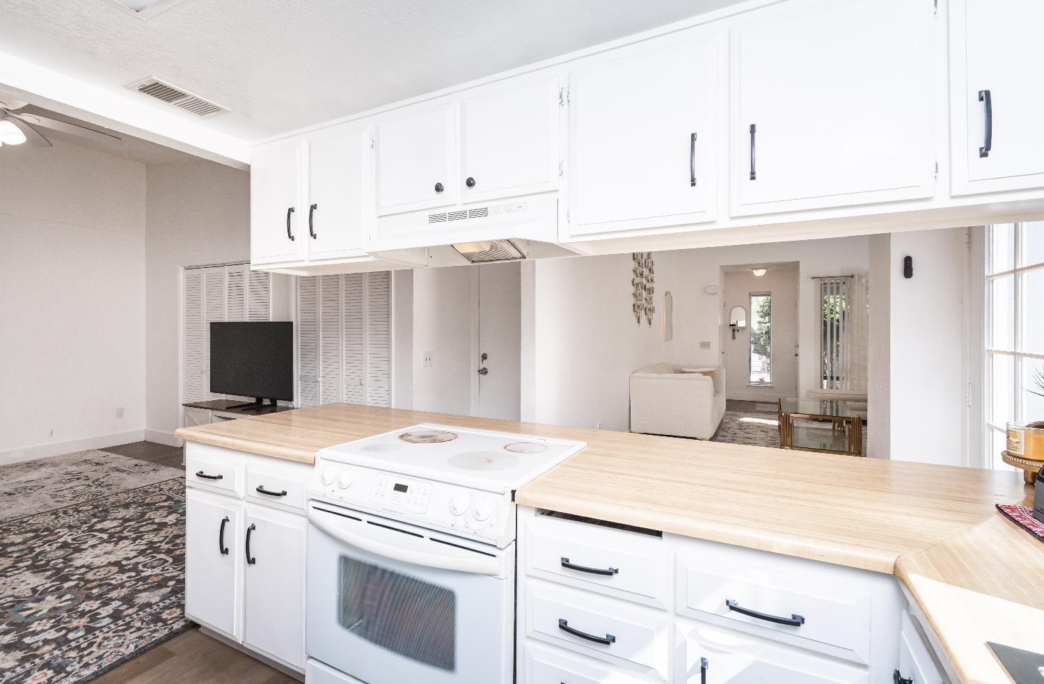 2000 Inglis Way, Unit A Roseville, CA 95678 - Photo 16 of 45 a kitchen with stainless steel appliances kitchen island a white cabinets and sink