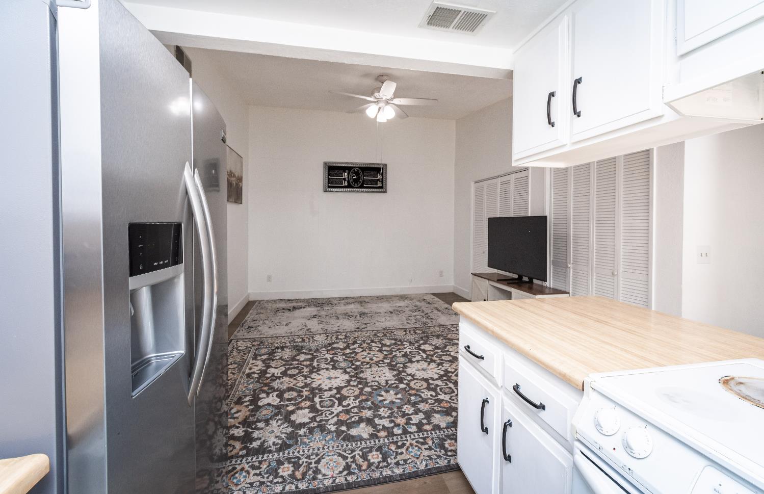 2000 Inglis Way, Unit A Roseville, CA 95678 - Photo 18 of 45 a bedroom with a bed and a flat screen tv