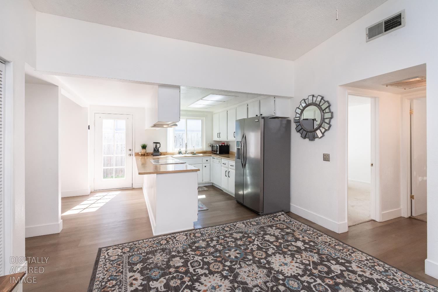 2000 Inglis Way, Unit A Roseville, CA 95678 - Photo 21 of 45 a kitchen with a refrigerator and a sink