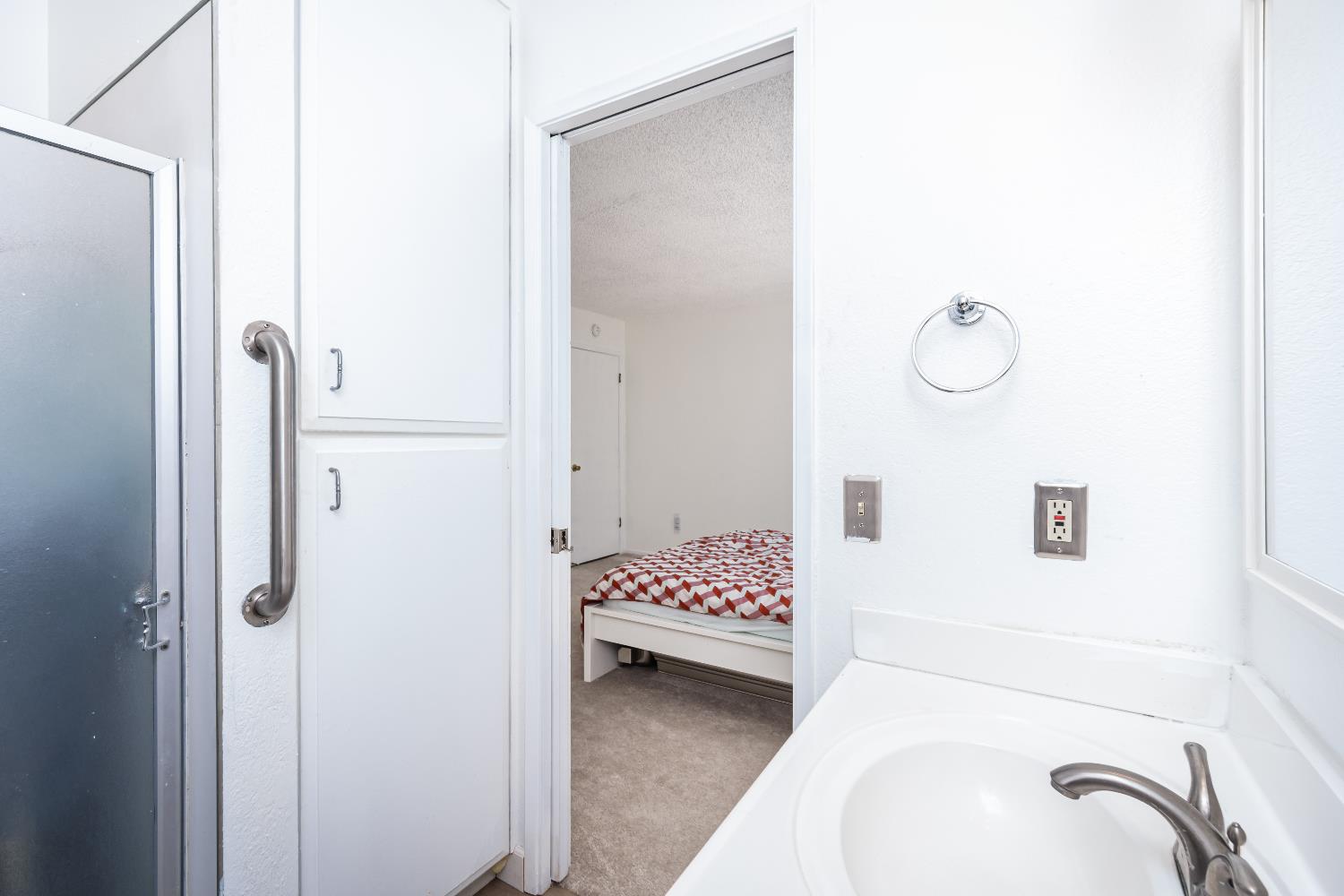 2000 Inglis Way, Unit A Roseville, CA 95678 - Photo 30 of 45 a bedroom with a bed and a shower
