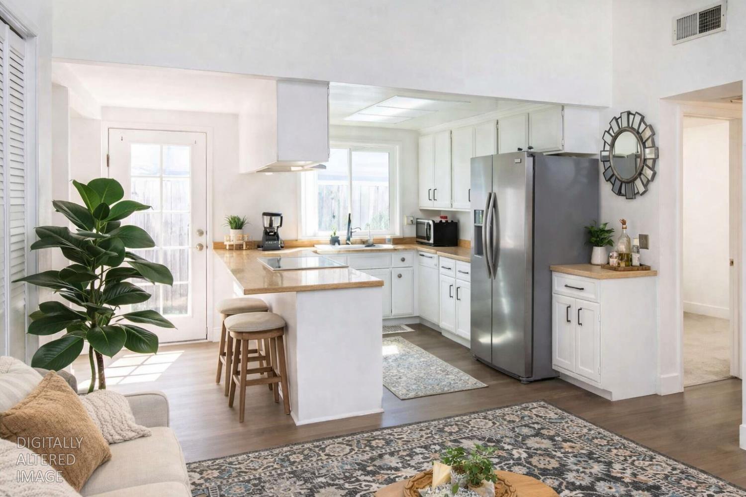 2000 Inglis Way, Unit A Roseville, CA 95678 - Photo 44 of 45 a living room with stainless steel appliances kitchen island granite countertop a refrigerator a sink a stove a washer and dryer