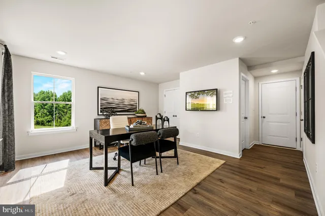 a workspace with furniture window and wooden floor