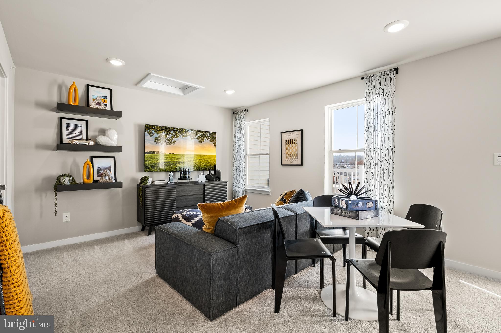 35 East Front Street Bridgeport, PA 19405 - Photo 30 of 40 a living room with furniture and a flat screen tv