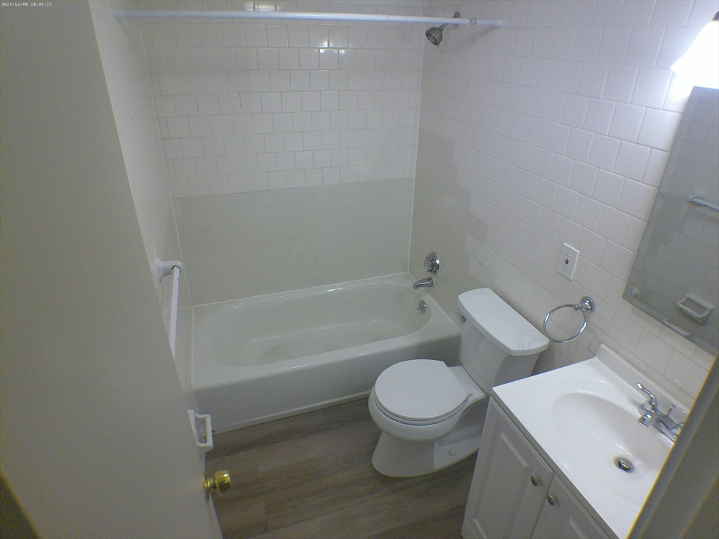 1862 Beacon Street, Unit 1B3 Brookline, MA 02445 - Photo 18 of 23 a white toilet sitting next to a bath tub
