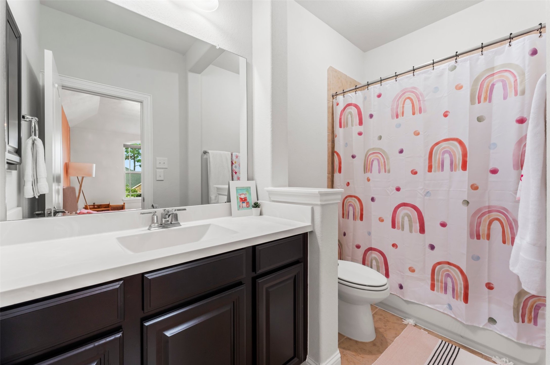 1053 Bat Hawk Court Conroe, TX 77385 - Photo 41 of 50 a bathroom with a sink and a mirror