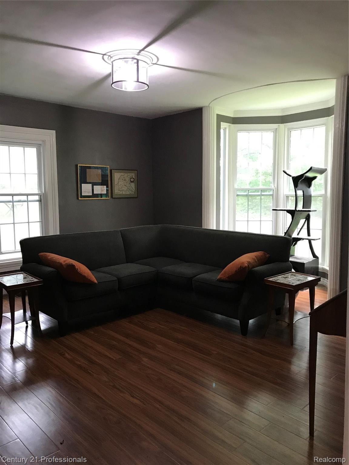 7222 Tucker Road Holly, MI 48442 - Photo 12 of 36 Large Living Room with Floor to Ceiling Bay Window for Extra Light & Space & Newer Floors...