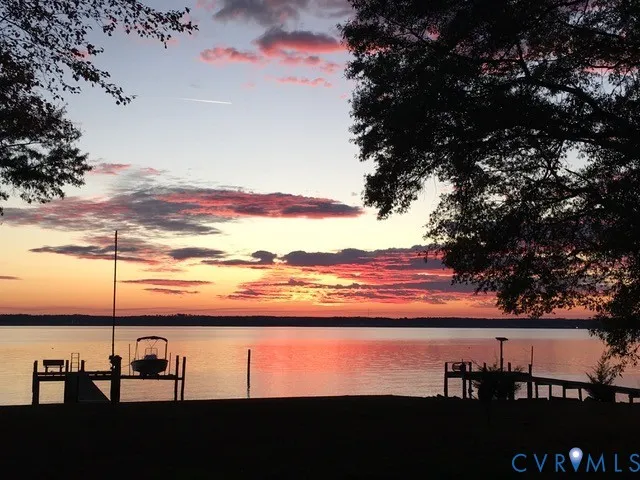 a view of a lake and sunset