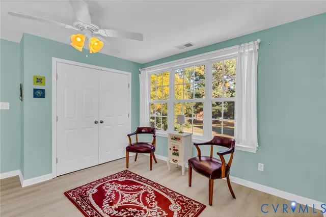 a living room with furniture and a window