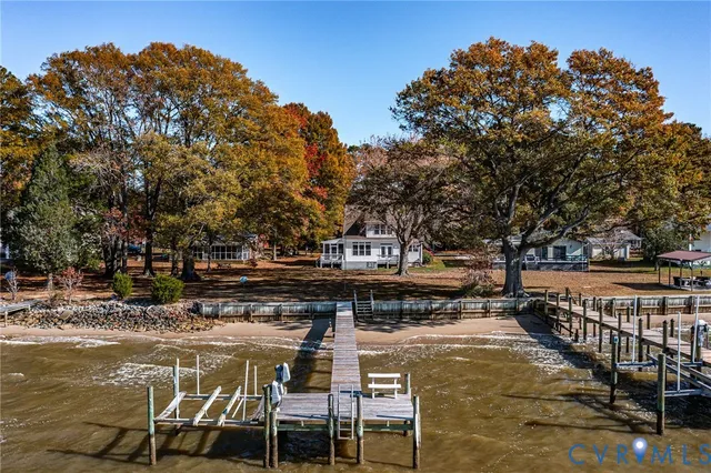 a swimming pool with outdoor seating and yard