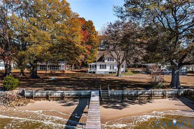 a view of a house with large trees