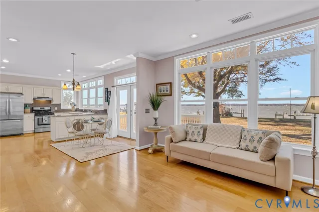 a living room with furniture and large windows