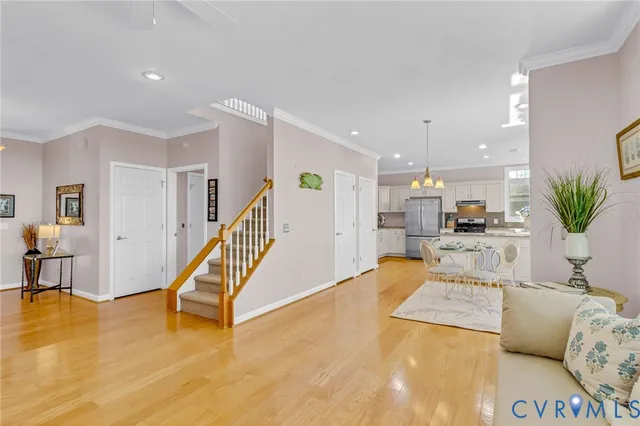 a living room with furniture and kitchen view