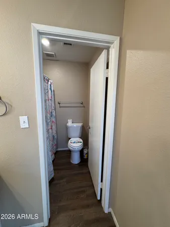 a view of a bathroom from a hallway