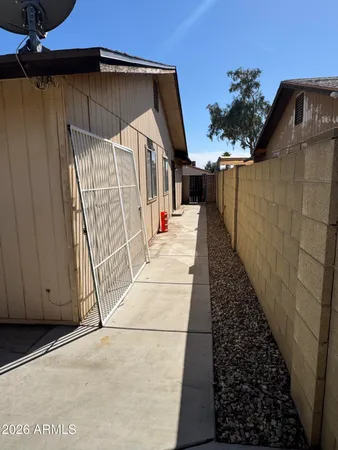 a path view of a house with wooden floor