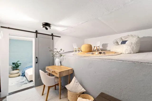 a bathroom with a sink mirror and toilet