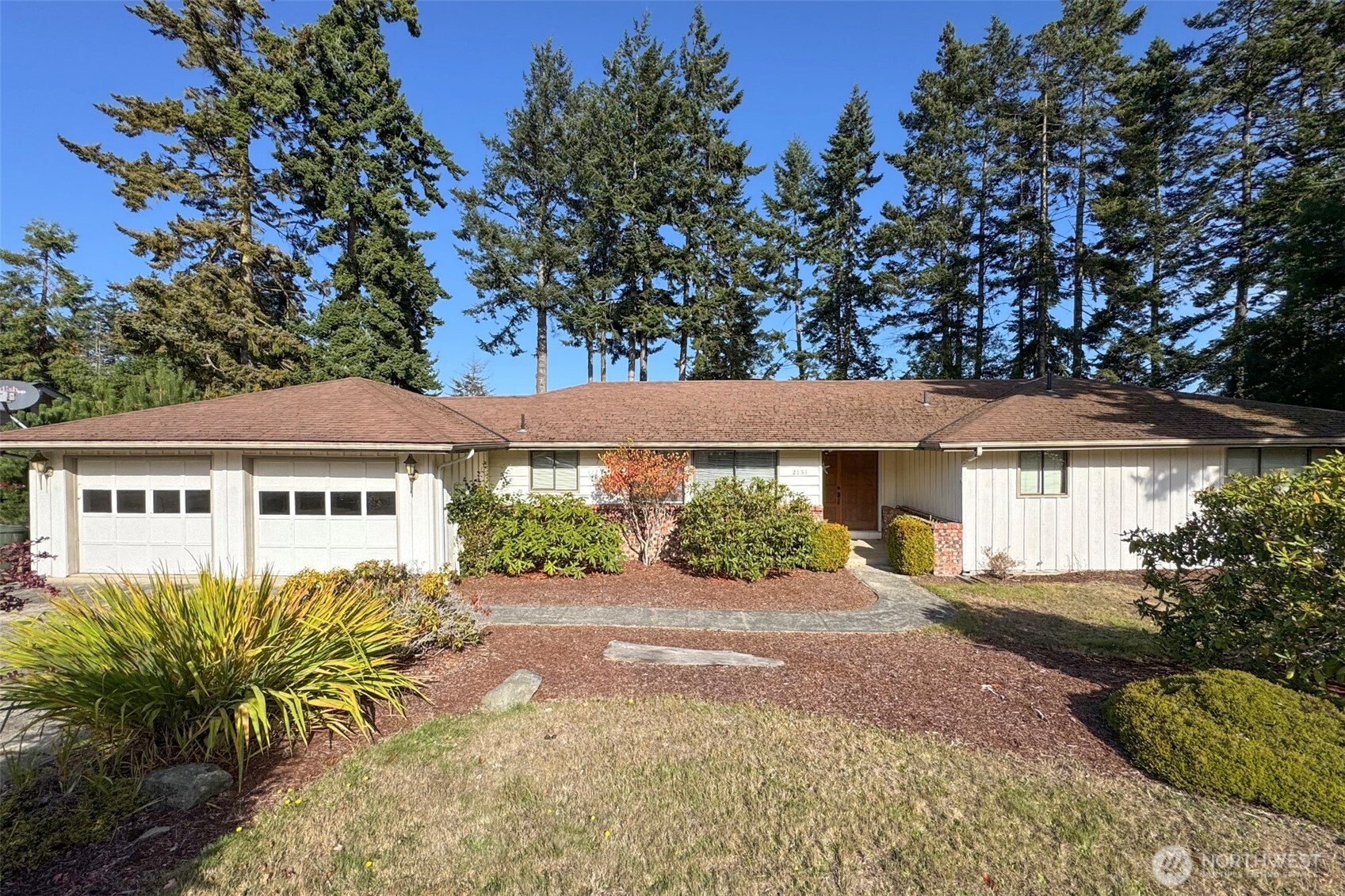 2131 West 7th Street Port Angeles, WA 98363 - Photo 1 of 40 a front view of a house with a yard and potted plants