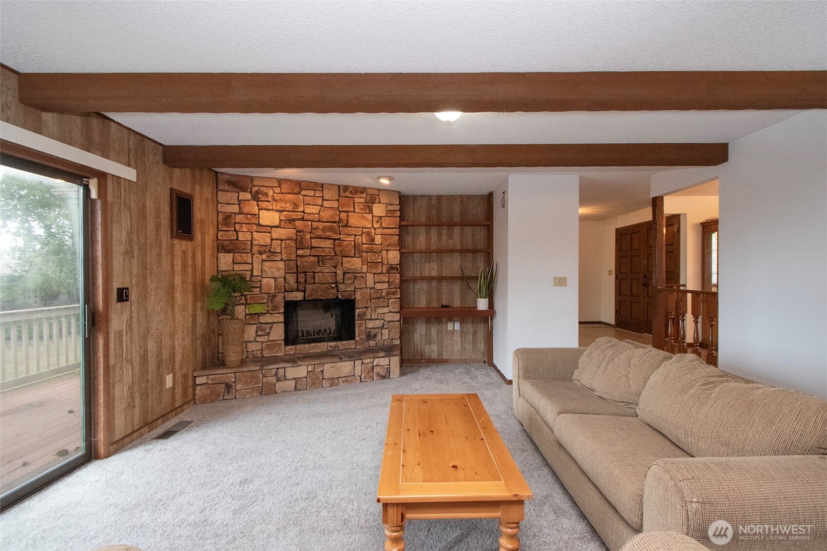 2131 West 7th Street Port Angeles, WA 98363 - Photo 14 of 40 a living room with furniture a fireplace and a flat screen tv