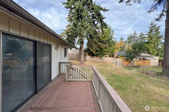 a view of a house with a yard and sitting area