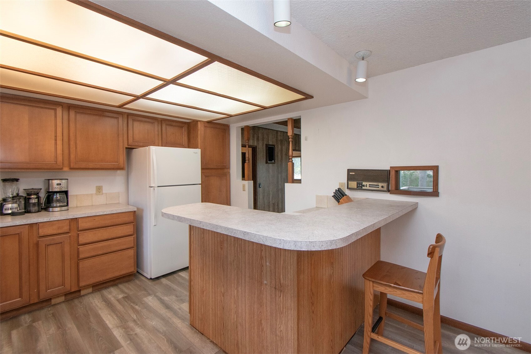 2131 West 7th Street Port Angeles, WA 98363 - Photo 8 of 40 a dining room with a sink a refrigerator and a stove top oven