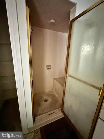 a view of a hallway view with furniture and a window