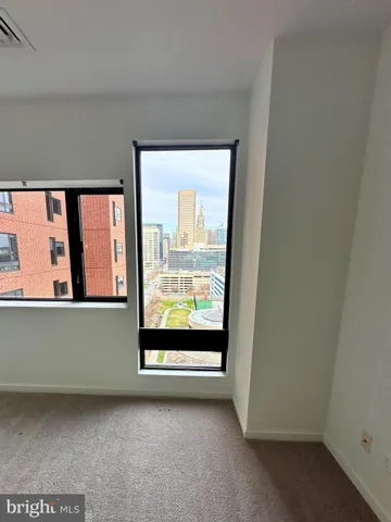 an empty room with large window