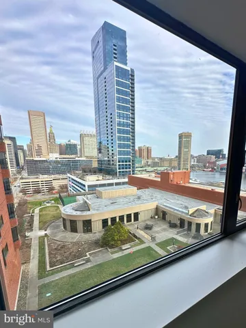 a view of a hallway view with wooden floor and staircase