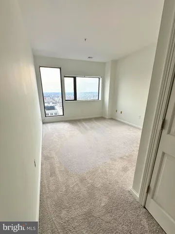 a view of an empty room with a window