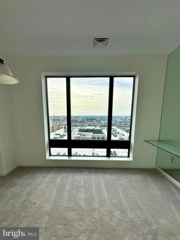 a view of a hallway with a outdoor space