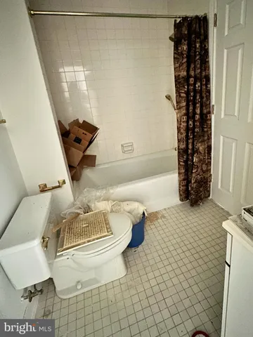 a room with water heater and refrigerator