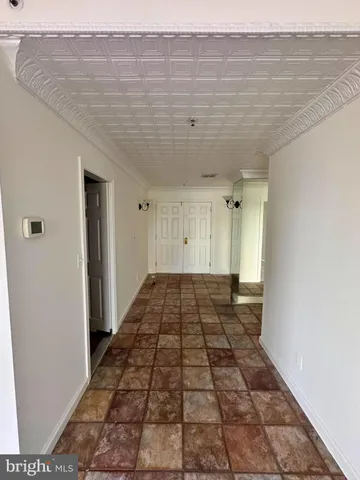 a kitchen with stainless steel appliances granite countertop a refrigerator and a stove