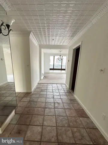 a view of a room with closet and wooden floor