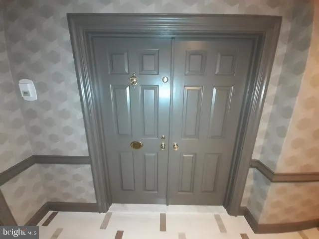 a bathroom with a sink a toilet a mirror and shower