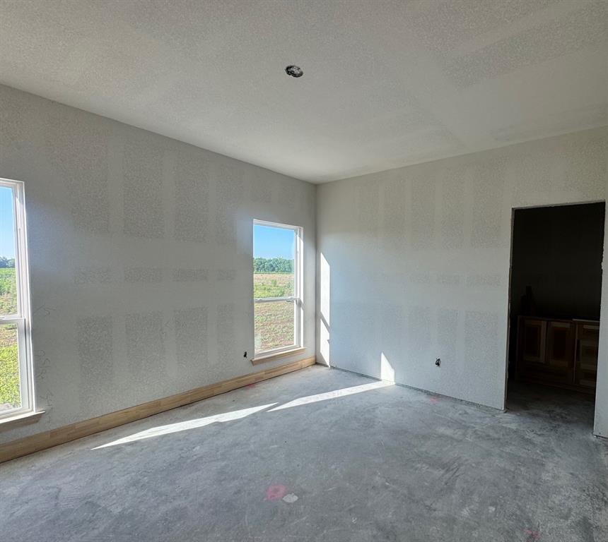 173 Willow Branch Road McGregor, TX 76657 - Photo 8 of 18 an empty room with windows