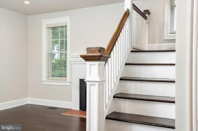 a view of entryway with wooden floor and stairs