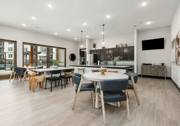 a view of a dining room with furniture and wooden floor