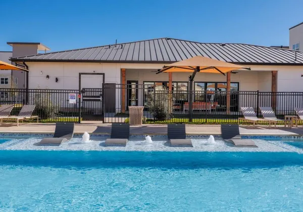 a view of a swimming pool with a patio